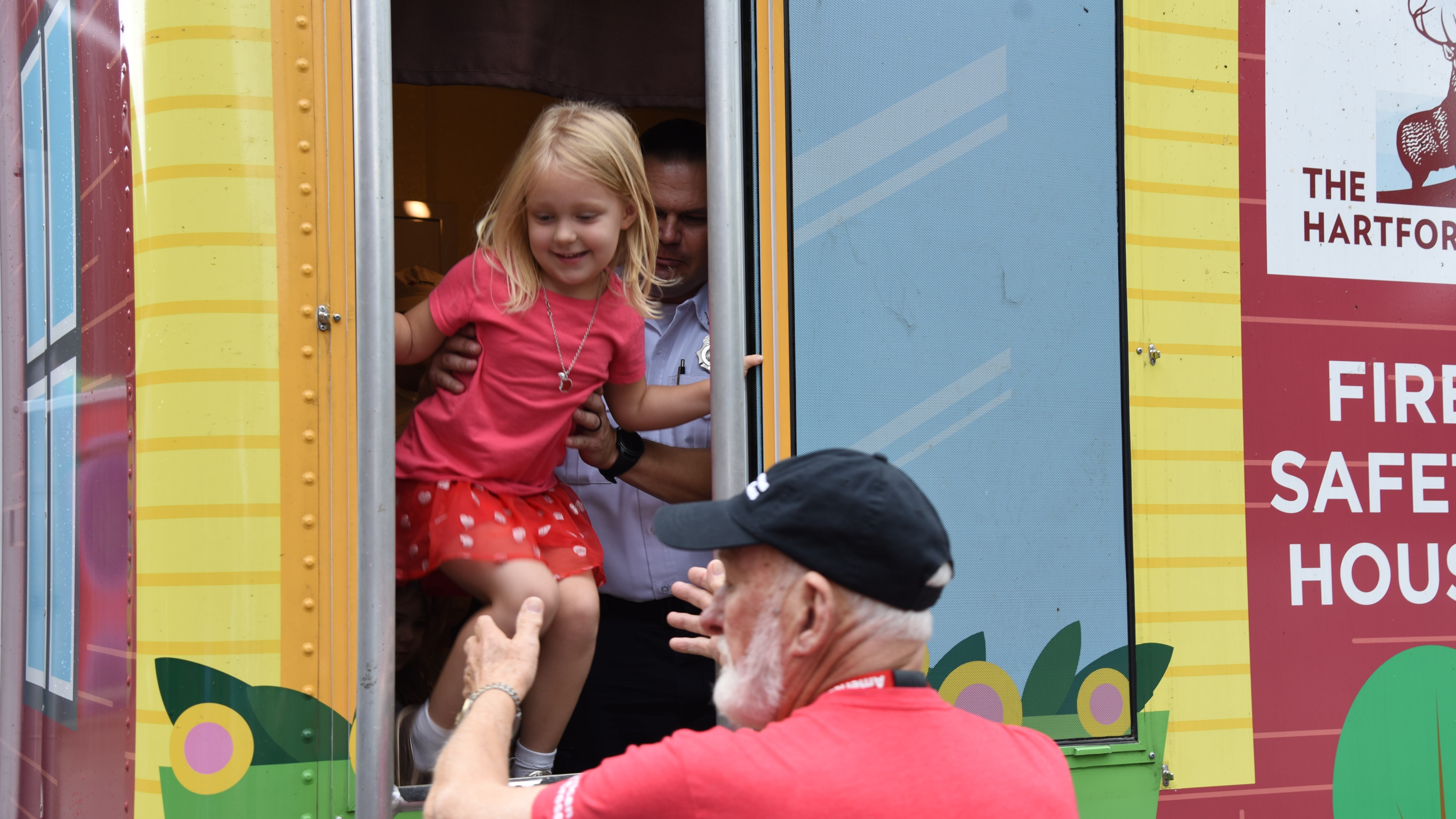 A student from Beaumont Magnet Academy practices exiting a window of the Fire Safety House, which is sponsored by The Hartford, on September 26, 2019. 